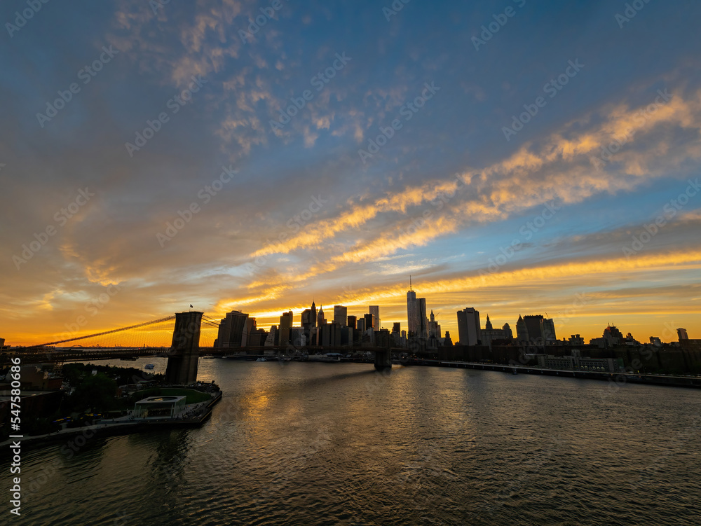 Sunset afterglow of the Brooklyn Bridge and New York City skyline