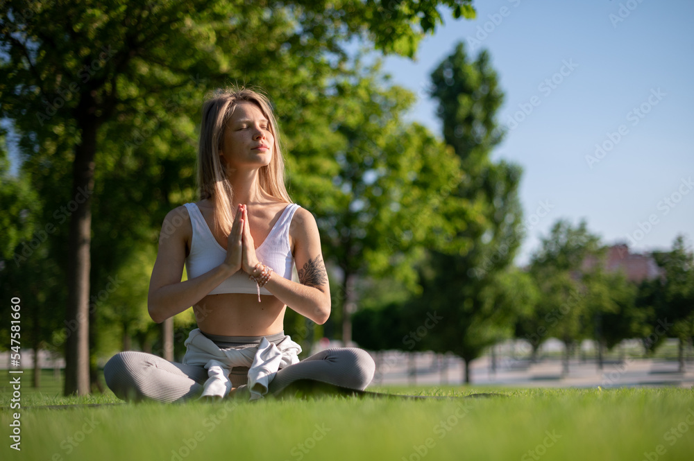 Girl practice yoga meditation outdoor in park Girl practice yoga meditation outdoor in park