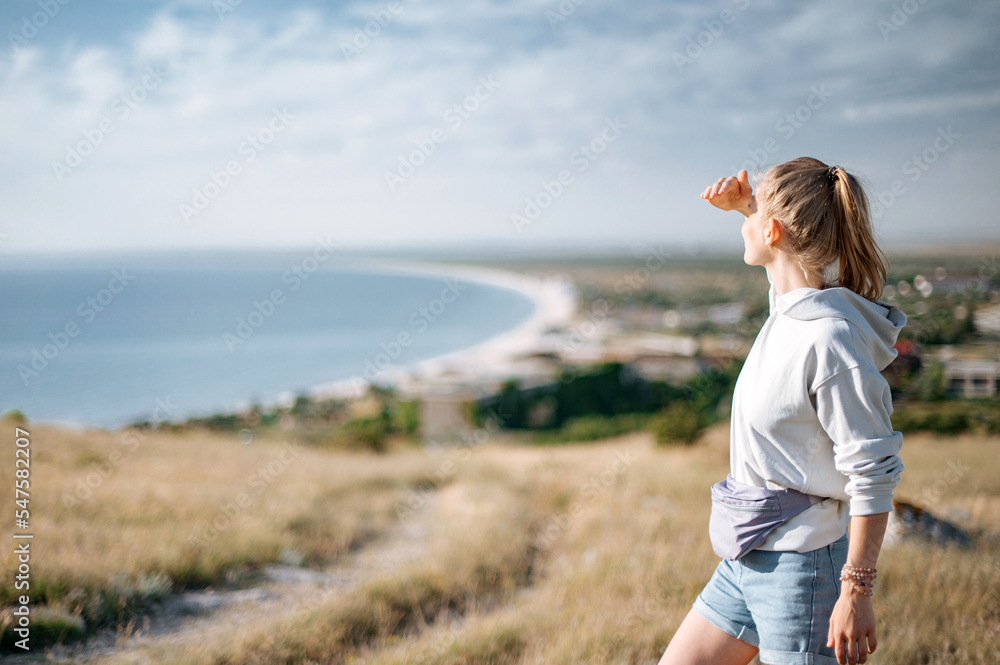 Traveller girl outdoor in park looking into the horizon