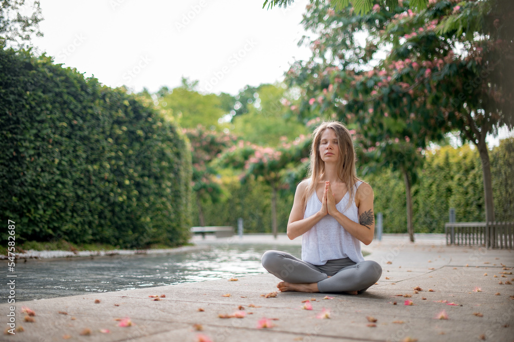 Girl practice yoga meditation outdoor in park Girl practice yoga meditation outdoor in park