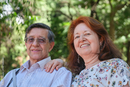 Senior Hispanic couple enjoying time together in a park, outdoors. Concepts: enjoyment of nature, active retirement. © Carolina Jaramillo