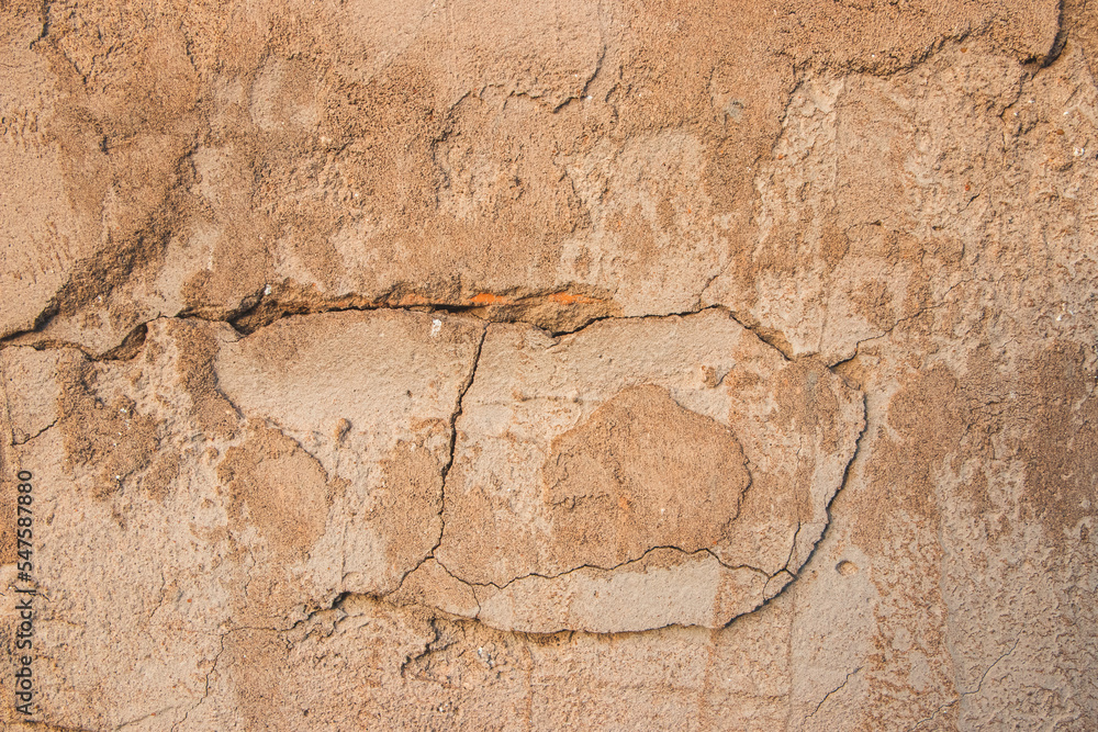 Fototapeta premium The texture of the wall of an old 