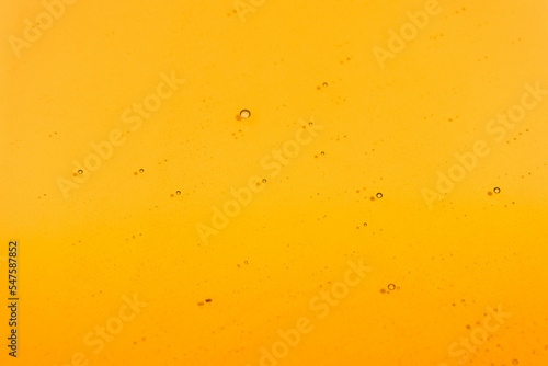 Sweet honey flowing on white background. Honey liquid texture. Healthy food concept. Selective focus.