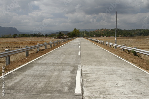 Empty rural road in the Philippines during the day © Vincent