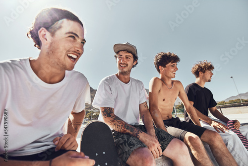 Skateboard, friends and group, men and freedom at urban skate park, city and relaxing summer for training, outdoor action and sports hobby in USA. Young skater guys, youth culture and cool lifestyle photo