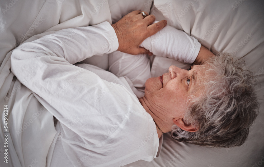 Senior woman, bed and insomnia stress in house while tired, worry and anxiety in retirement. Elderly lady, home bedroom and mental health with headache, frustrated and fail to sleep in nursing home Senior woman, bed and insomnia stress in house while tired, worry and anxiety in retirement. Elderly lady, home bedroom and mental health with headache, frustrated and fail to sleep in nursing home