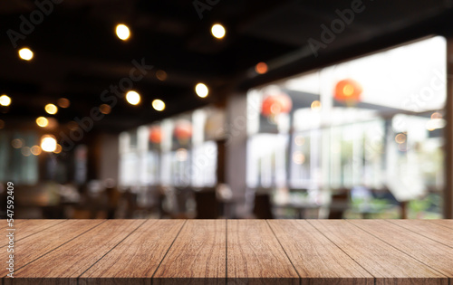 Wallpaper Mural Empty wooden table top with lights bokeh on blur restaurant background. Torontodigital.ca