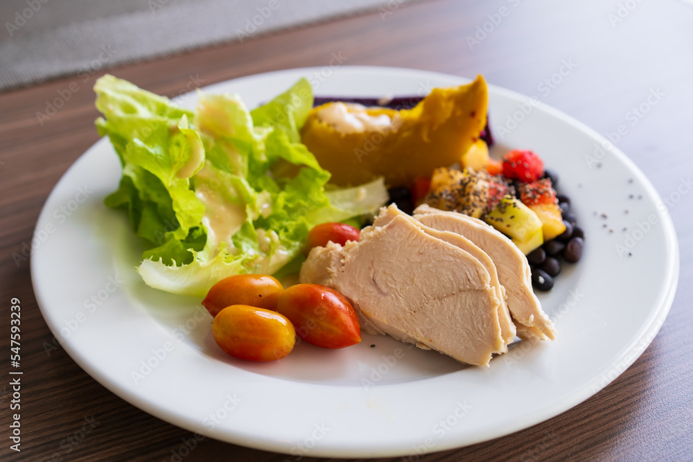 Baked chicken salad or steamed chicken breast and ridgepole with lettuce vegetable steam pumpkin queen tomato fruit sesame black beans and purple sweet potato for healthy clean food and diet breakfast Baked chicken salad or steamed chicken breast and ridgepole with lettuce vegetable steam pumpkin queen tomato fruit sesame black beans and purple sweet potato for healthy clean food and diet breakfast