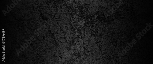 Abstract structured black concrete wall background, scary black grunge goth design. horror black background, Slightly light black concrete cement texture for background.