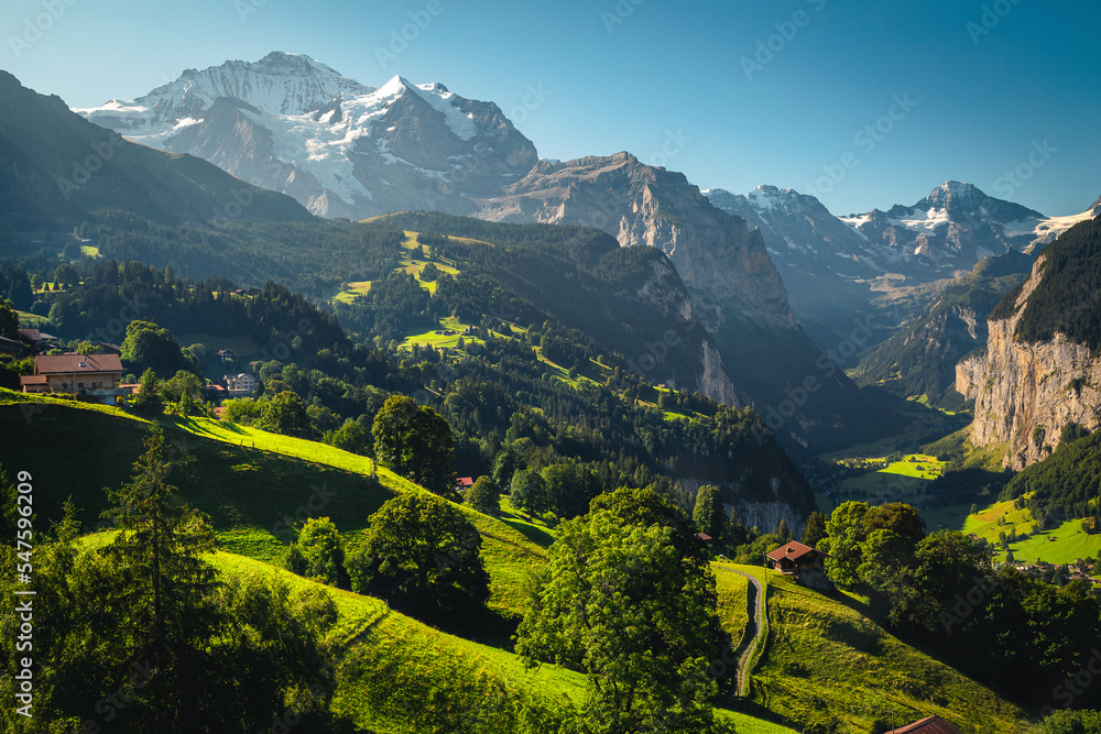 Obraz premium Majestic deep valley with waterfalls and green fields, Lauterbrunnen, Switzerland