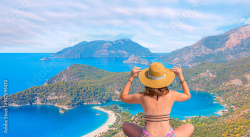 Aerial view of Blue Lagoon in Oludeniz - Young fashion girl relax on the beach of sea - Oludeniz, Fethiye