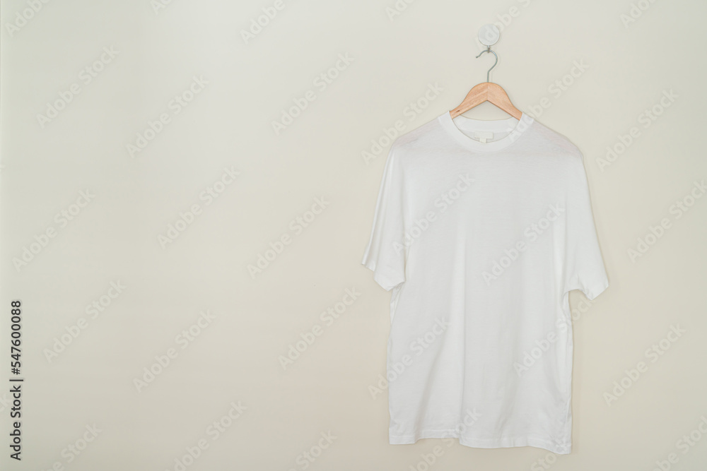 t-shirt hanging with wood hanger t-shirt hanging with wood hanger