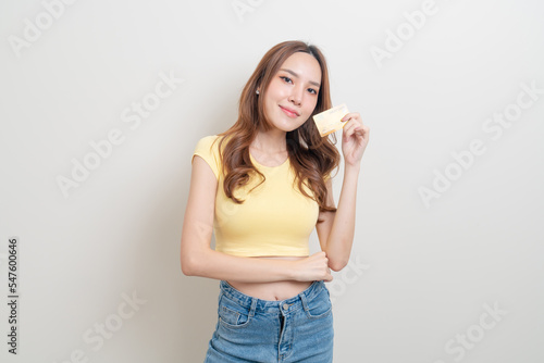 portrait beautiful Asian woman holding credit card