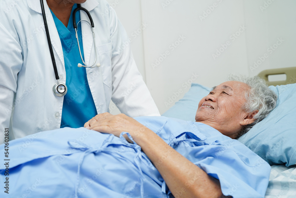 Doctor taking care, help and encourage Asian elder senior woman patient in clinic hospital. Doctor taking care, help and encourage Asian elder senior woman patient in clinic hospital.