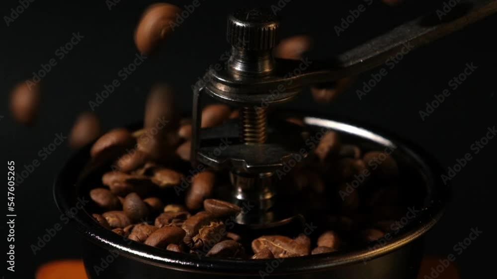 Slow motion of roasted coffee beans falling. Organic coffee seeds. Slow motion of roasted coffee beans falling. Organic coffee seeds.