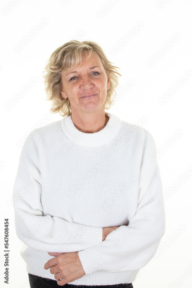 Middle age blond woman winter sweater isolated white background Middle age blond woman winter sweater isolated white background