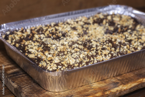 Chocolate cake with nuts in the form of baking foil