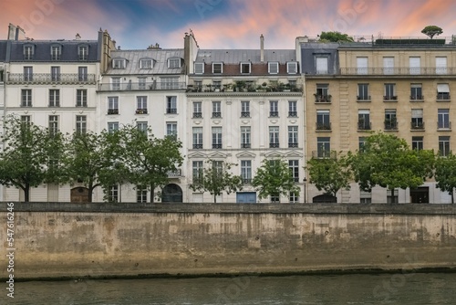 Paris, ile saint-louis and quai de Bethune, beautiful ancient buildings, sunset
