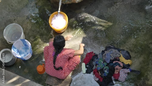Rural Indian woman washing cloths