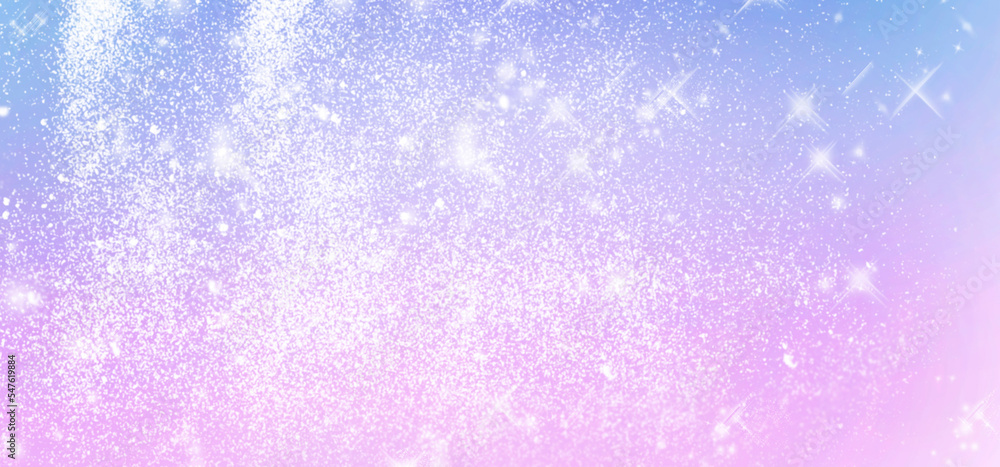 Winter shiny blurred background in light blue pink colors. Blurry Christmas holiday background with snow flakes, soft flares of light
