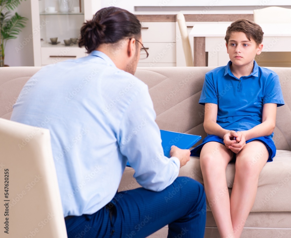 Internet addicted boy visiting male doctor