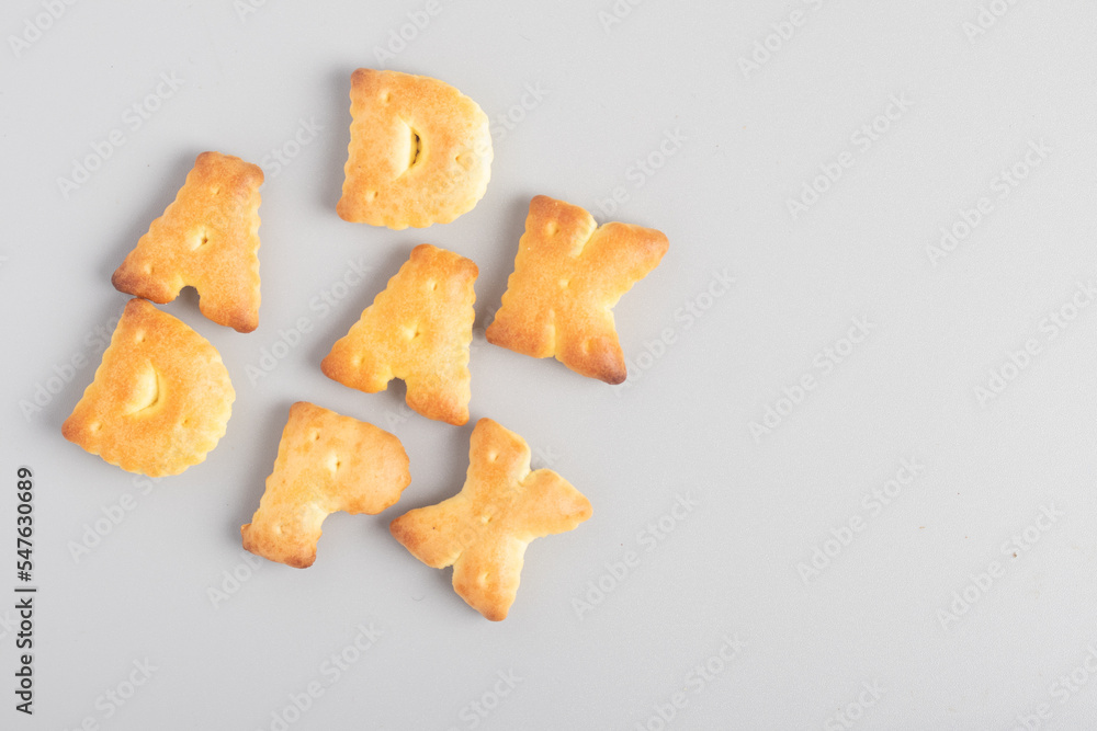 English letter bread snack on gray background English letter bread snack on gray background