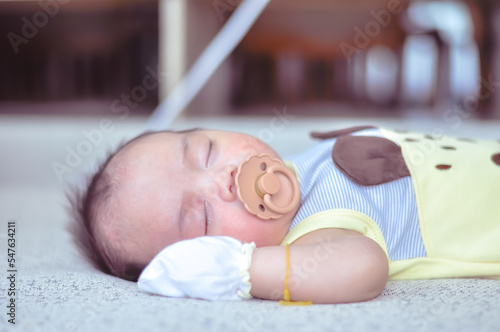 Close up of Cute baby sleeping with a pacifier