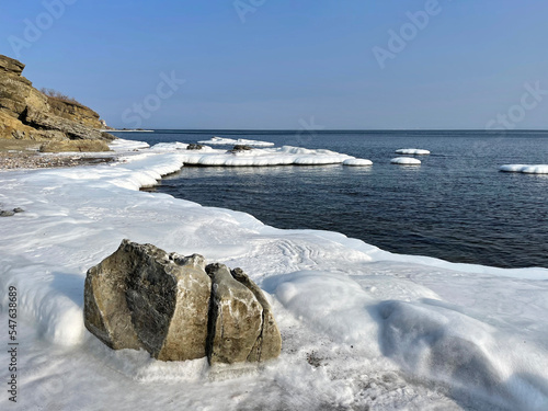 The ice-covered coastal strip of one of the bays of the Ussuri Bay, Russia, Vladivostok