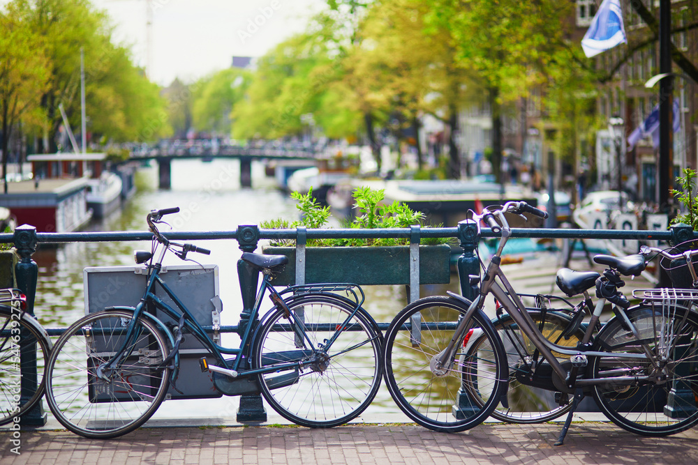 Bicycles parked on a bridge in Amsterdam