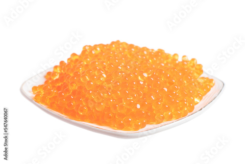 Red caviar in the ceramic plate isolated on a white background. Trout or salmon caviar close up. Macro shot.