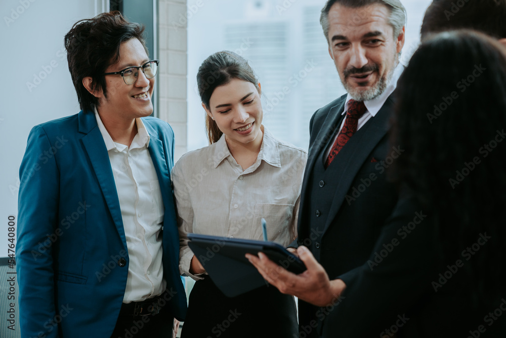 We have great results. Group of young cheerful business people in casual wear working together on new project while sitting in the creative office We have great results. Group of young cheerful business people in casual wear working together on new project while sitting in the creative office