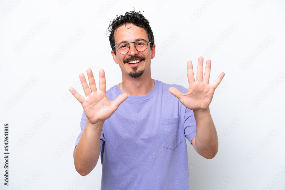 Young man with moustache isolated on white background counting ten with fingers Young man with moustache isolated on white background counting ten with fingers