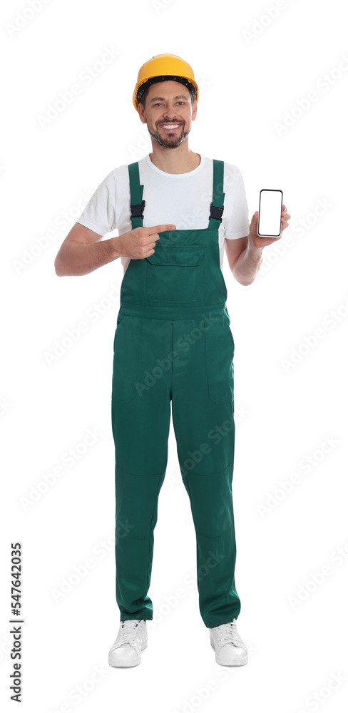 Professional repairman in uniform with phone on white background Professional repairman in uniform with phone on white background