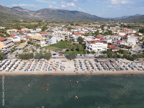 Aerial drone view plataria greece, beach crowded with tourists in vacation on summer in famous greek caribbean plataria town epirus thesprotia
 photo