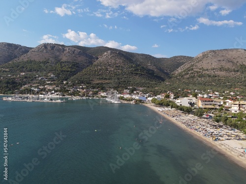 Fototapeta Naklejka Na Ścianę i Meble -  Aerial drone view plataria greece, beach crowded with tourists in vacation on summer in famous greek caribbean plataria town epirus thesprotia
