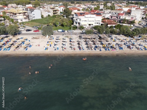 Aerial drone view plataria greece, beach crowded with tourists in vacation on summer in famous greek caribbean plataria town epirus thesprotia
