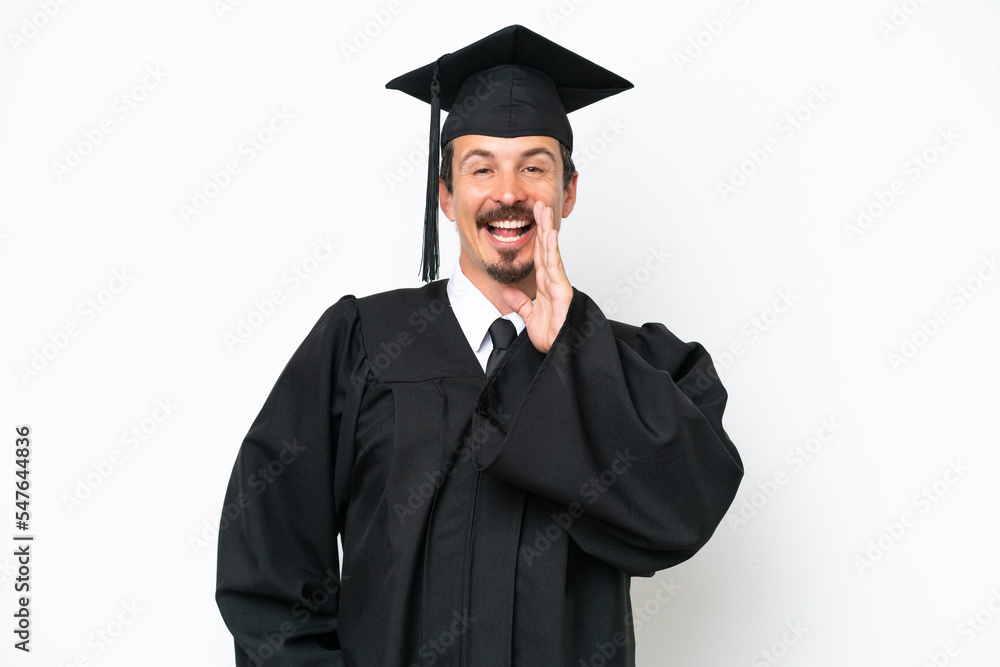 Young university graduate man isolated on white background shouting with mouth wide open Young university graduate man isolated on white background shouting with mouth wide open