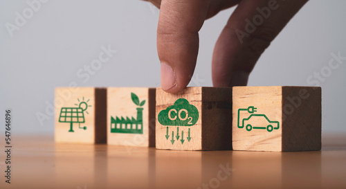 CO2 reducing ,Green factory and electric vehicle icon for decrease CO2 , carbon footprint and carbon credit to limit global warming from climate change, Bio Circular Green Economy concept.