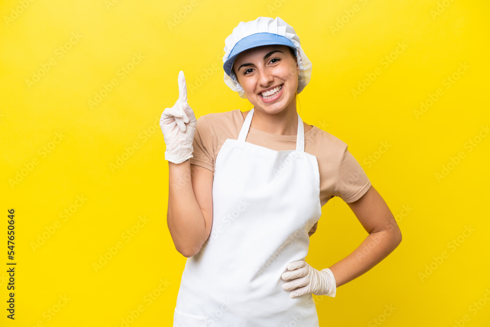 Fishwife woman over isolated background showing and lifting a finger in sign of the best Fishwife woman over isolated background showing and lifting a finger in sign of the best