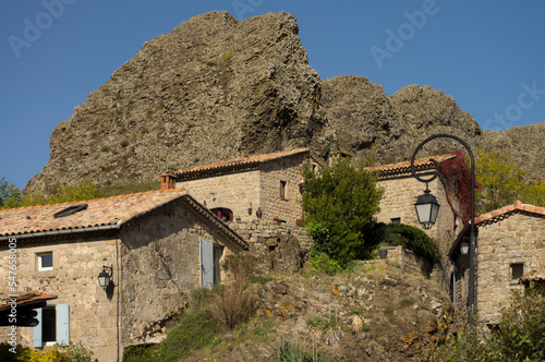 The picturesque village 07000 Ajoux with volcanic rock at 07000 Privas in the Ardeche France under blue sky photo