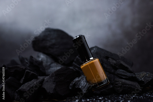 The nail color is brown, the back is charcoal black. and the background is dark gray photo