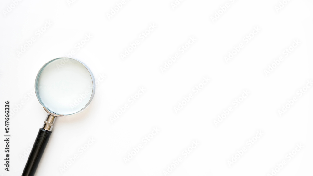 Close-up magnifier on white background with space for text Close-up magnifier on white background with space for text