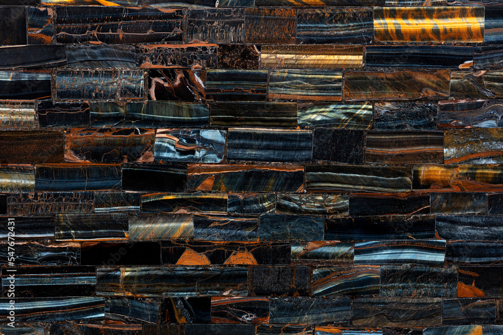 Tiger Eye Blue slab. Precious mineral quartz pattern. Exclusive luxury gemstone background. Natural semi precious stone texture. Material, background for unique interior, exterior design decoration. Tiger Eye Blue slab. Precious mineral quartz pattern. Exclusive luxury gemstone background. Natural semi precious stone texture. Material, background for unique interior, exterior design decoration.