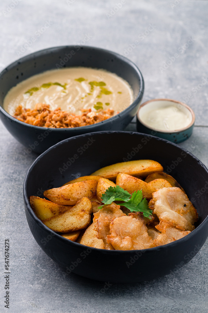 Lunch mushroom cream soup and fish with chips, cilantro and spices. Lunch mushroom cream soup and fish with chips, cilantro and spices.