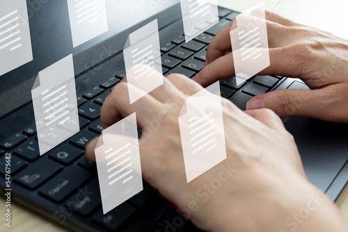 Valokuva Woman holds pen and writing to send electronic document or take note and another hand using laptop
