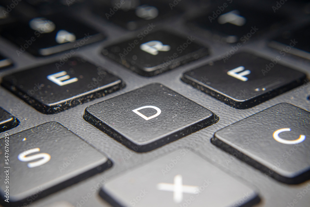Laptop keyboard keys are black and white Laptop keyboard keys are black and white