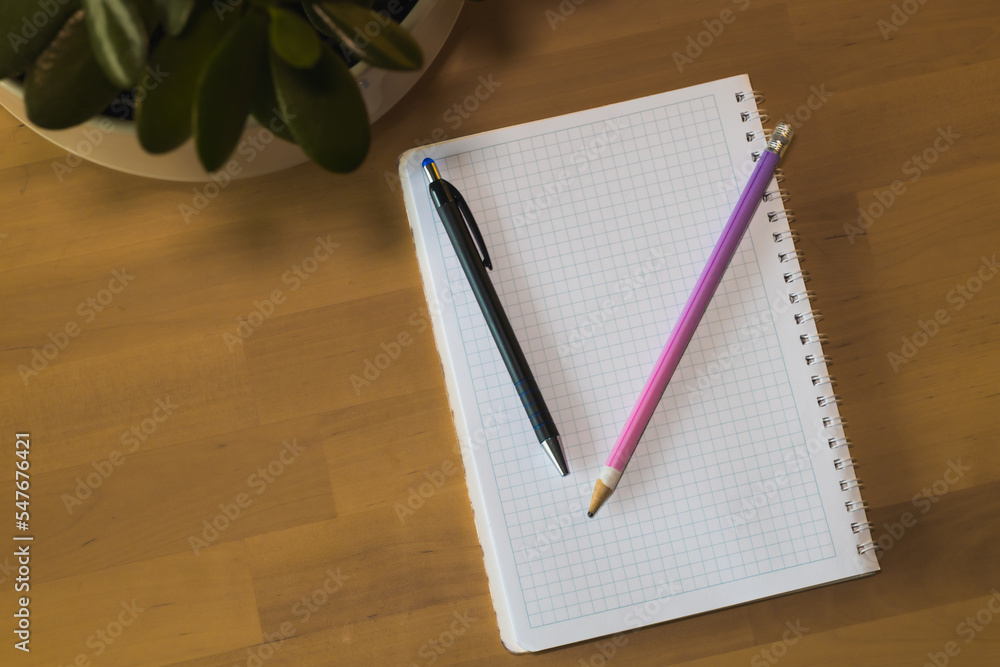 Notebook with pen and pencil. Home office Notebook with pen and pencil. Home office