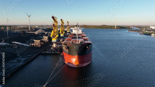 Coal storage transhipment for power stations in Germany, bulk logistics storage and loading of raw energy materials. Aerial. Global warming CO2 emissions, fossil energy supply.