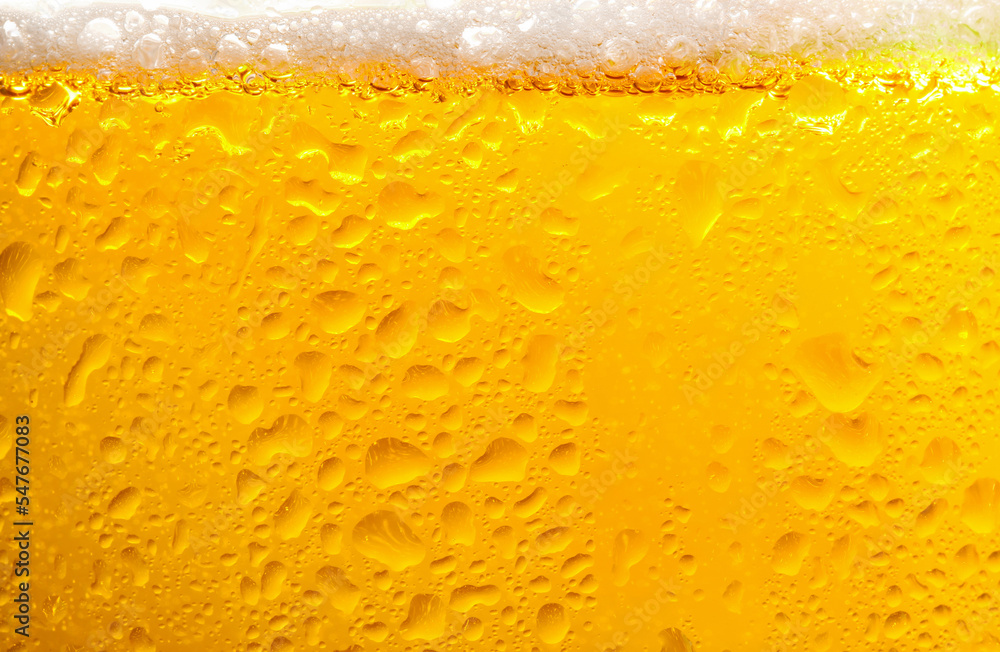 Glass of tasty cold beer with foam and condensation drops on white background, closeup Glass of tasty cold beer with foam and condensation drops on white background, closeup