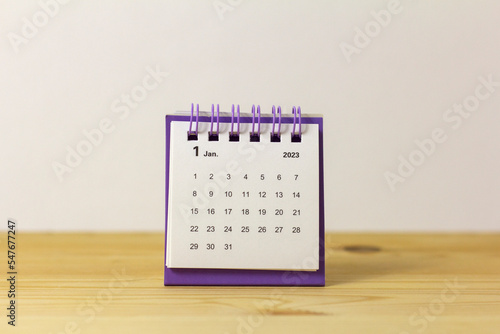 The calendar for January 2023 is on the table.